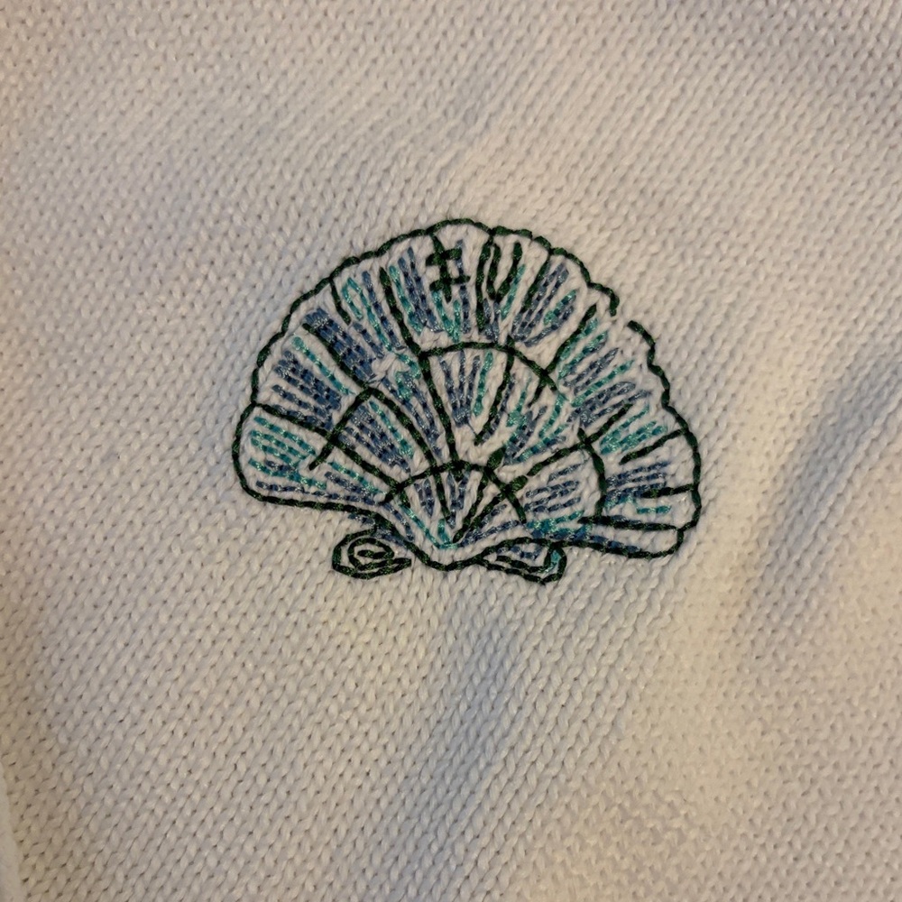 White Sweater with Embroidered Shell Design